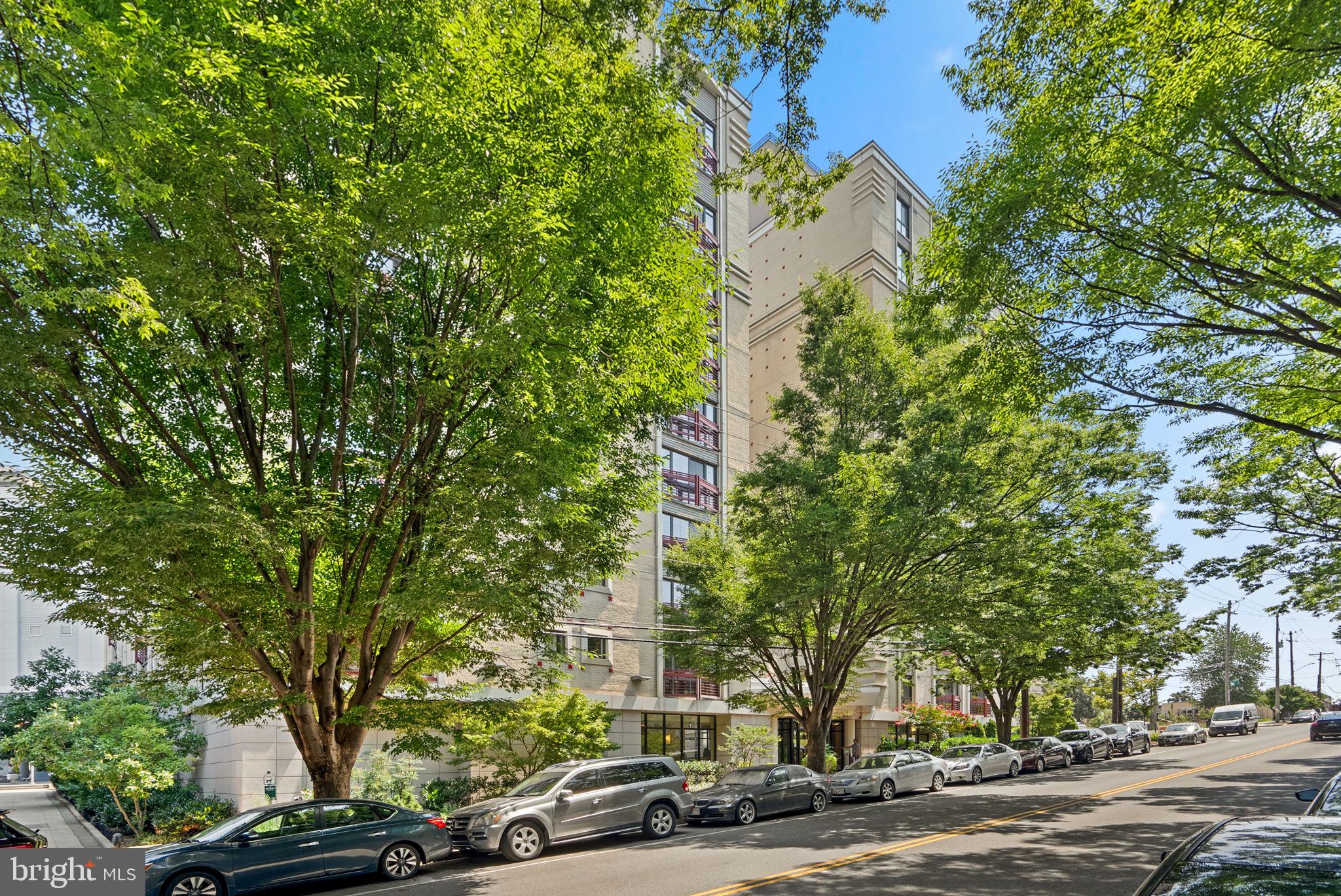 front view of a building with trees