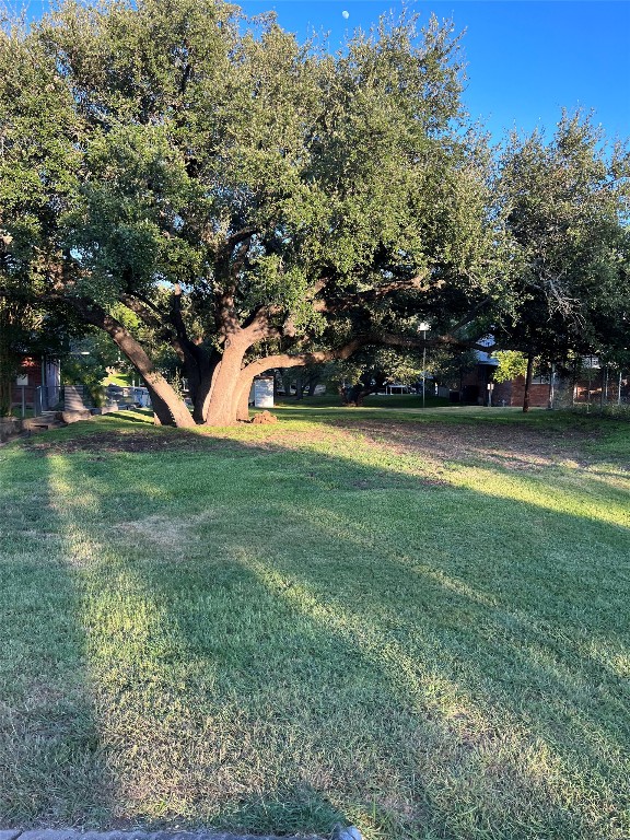 a view of yard with swimming pool and trees