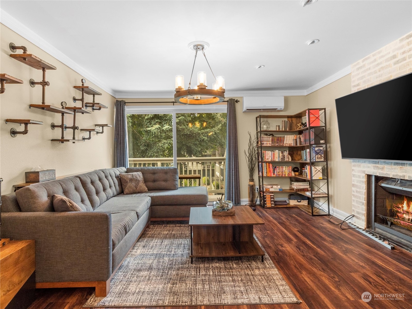 a living room with fireplace furniture and a flat screen tv