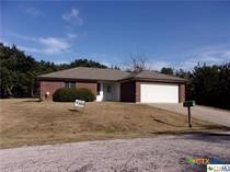 a view of a house with a yard and garage