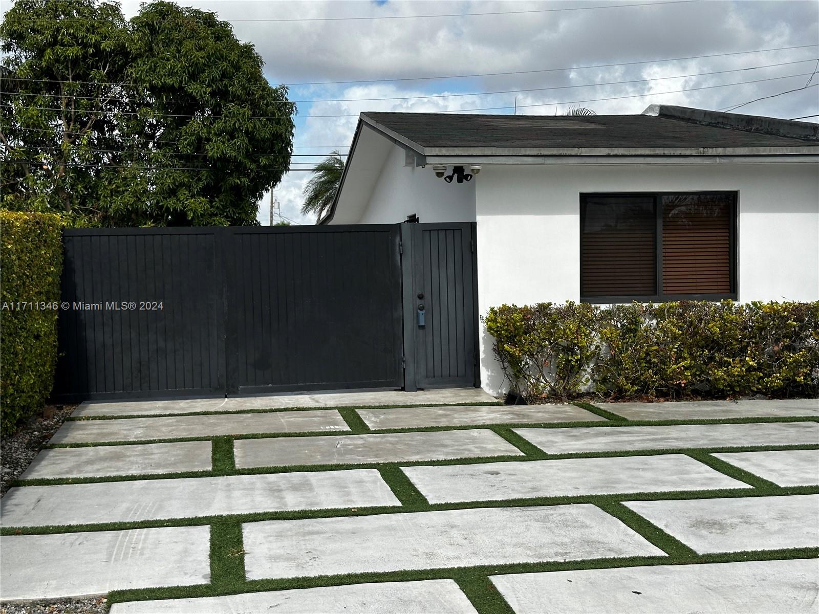 a view of entrance gate of the house