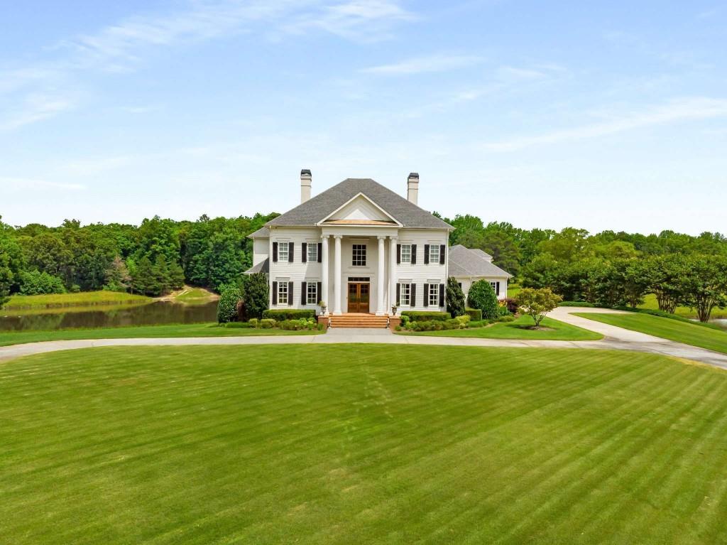 a front view of a house with a yard