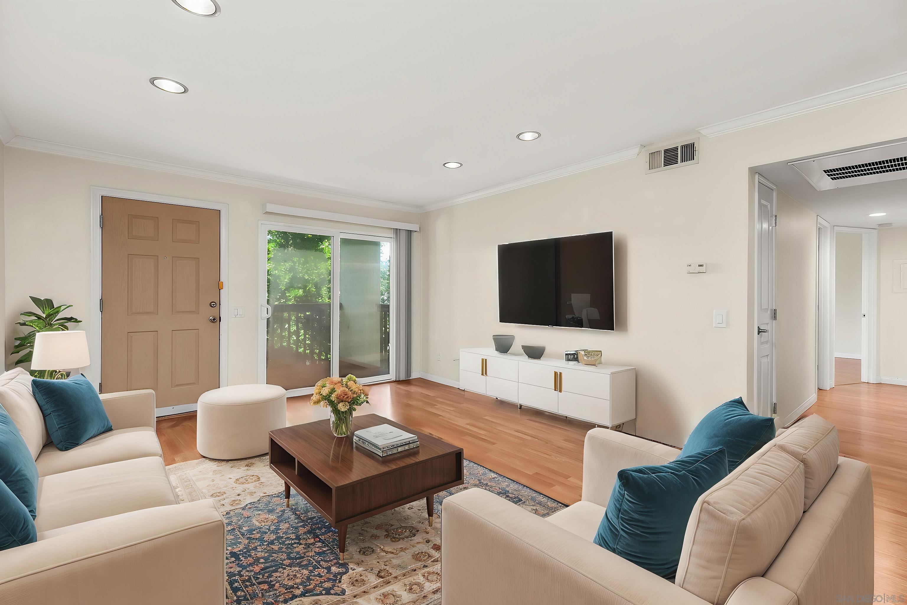 a living room with furniture and a flat screen tv