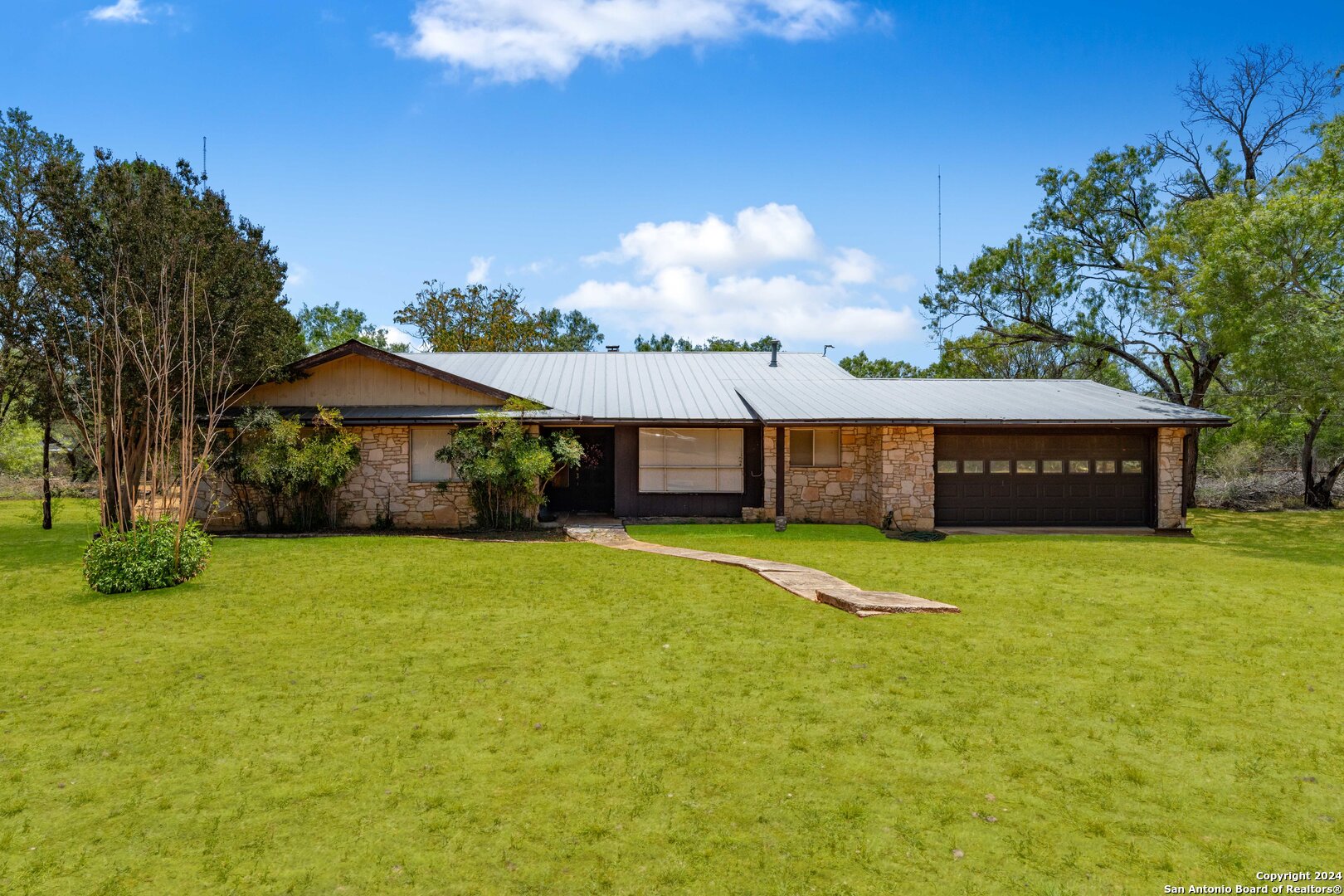 a front view of house with yard and seating area