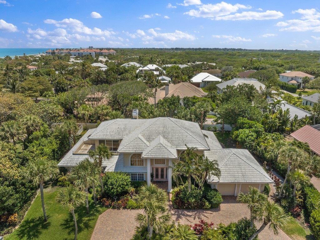 an aerial view of a house with a garden