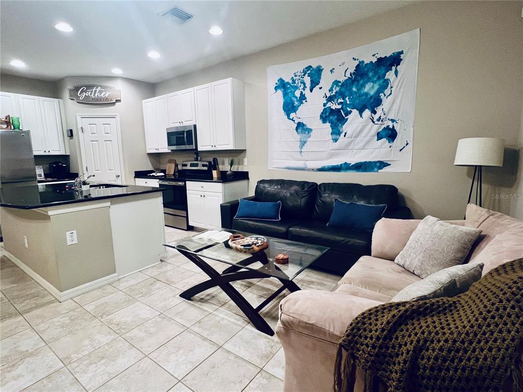 a living room with furniture and a couch