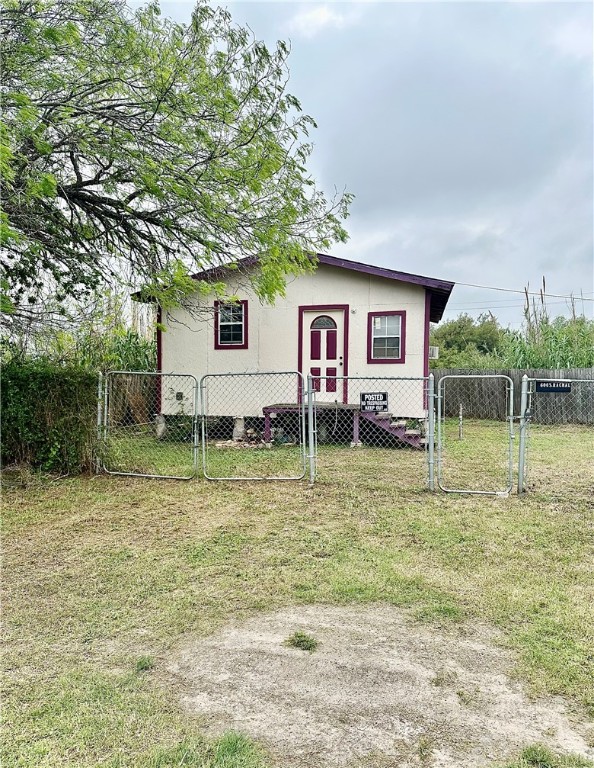 a backyard of a house with shaded area