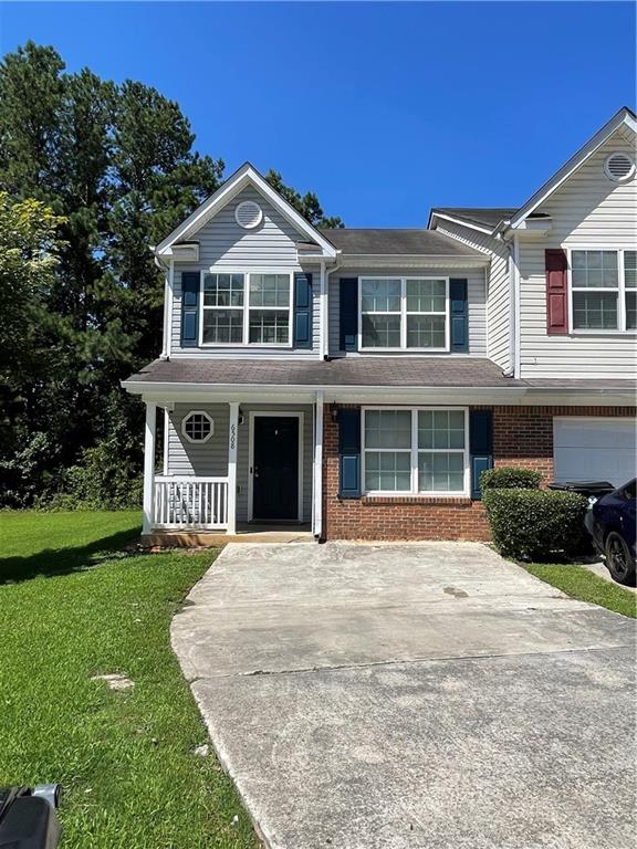 a front view of a house with a yard