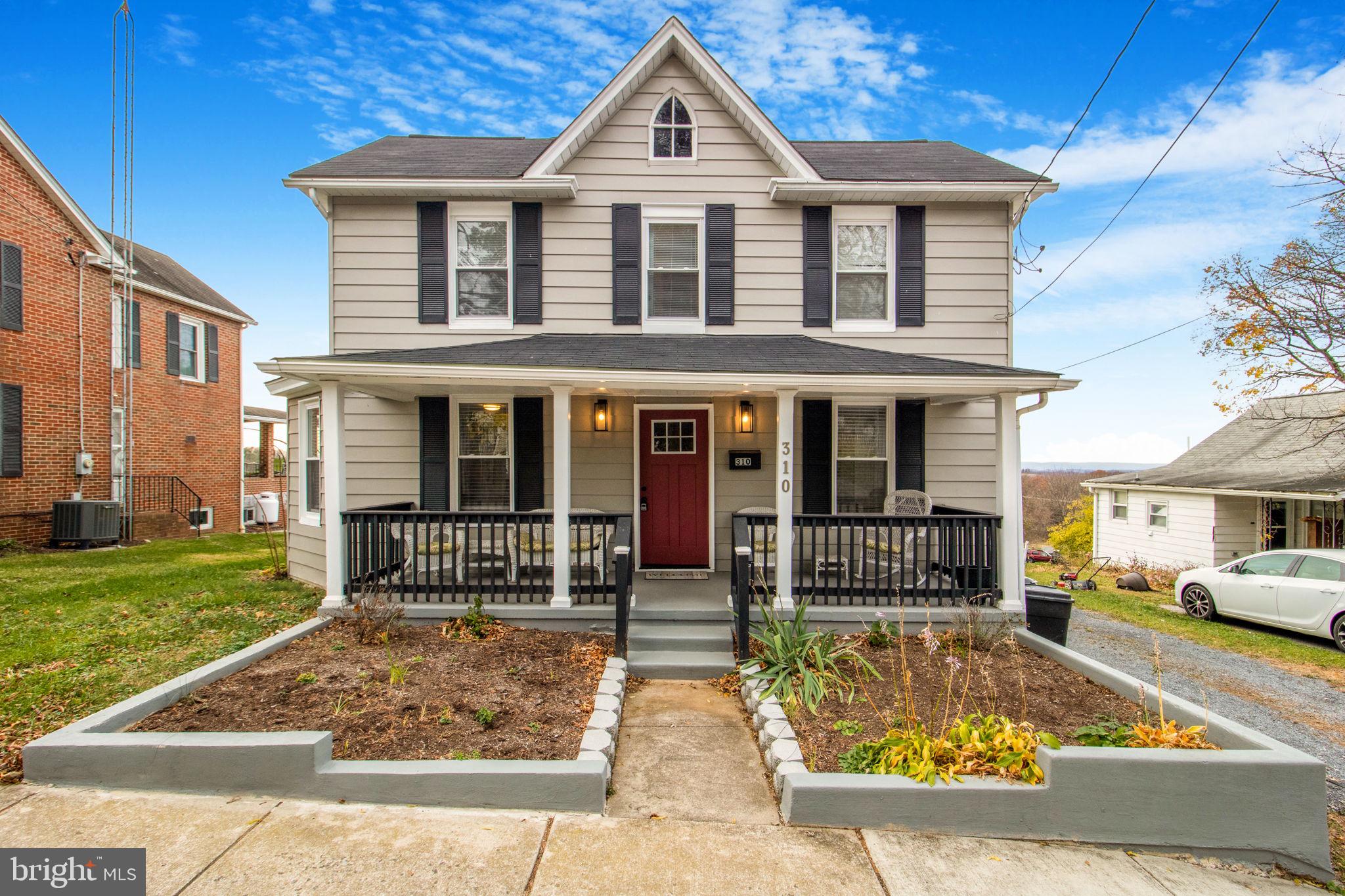 front view of a house with a yard