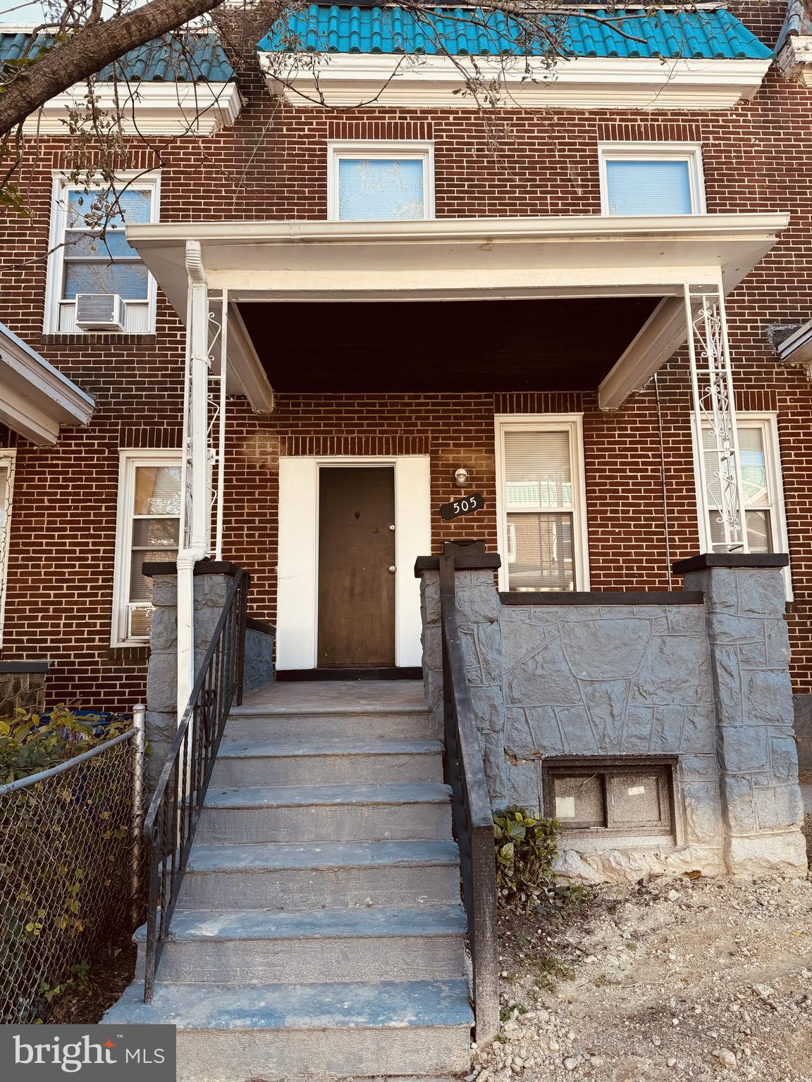 a front view of a house with stairs