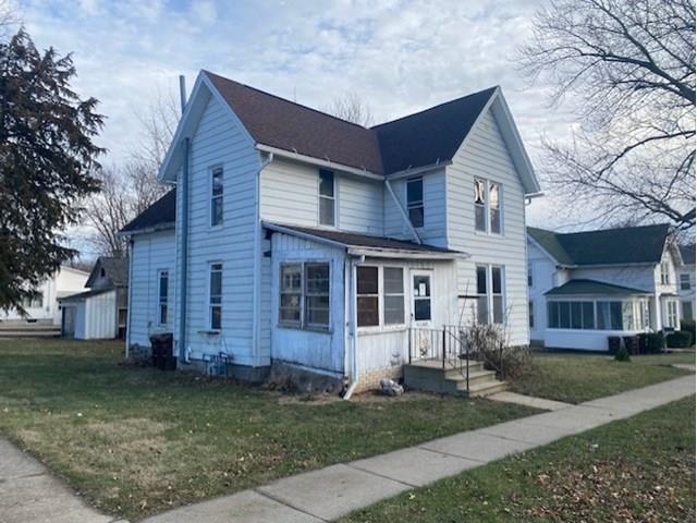 a front view of a house with a yard