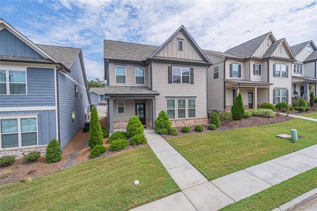 a front view of a house with a yard