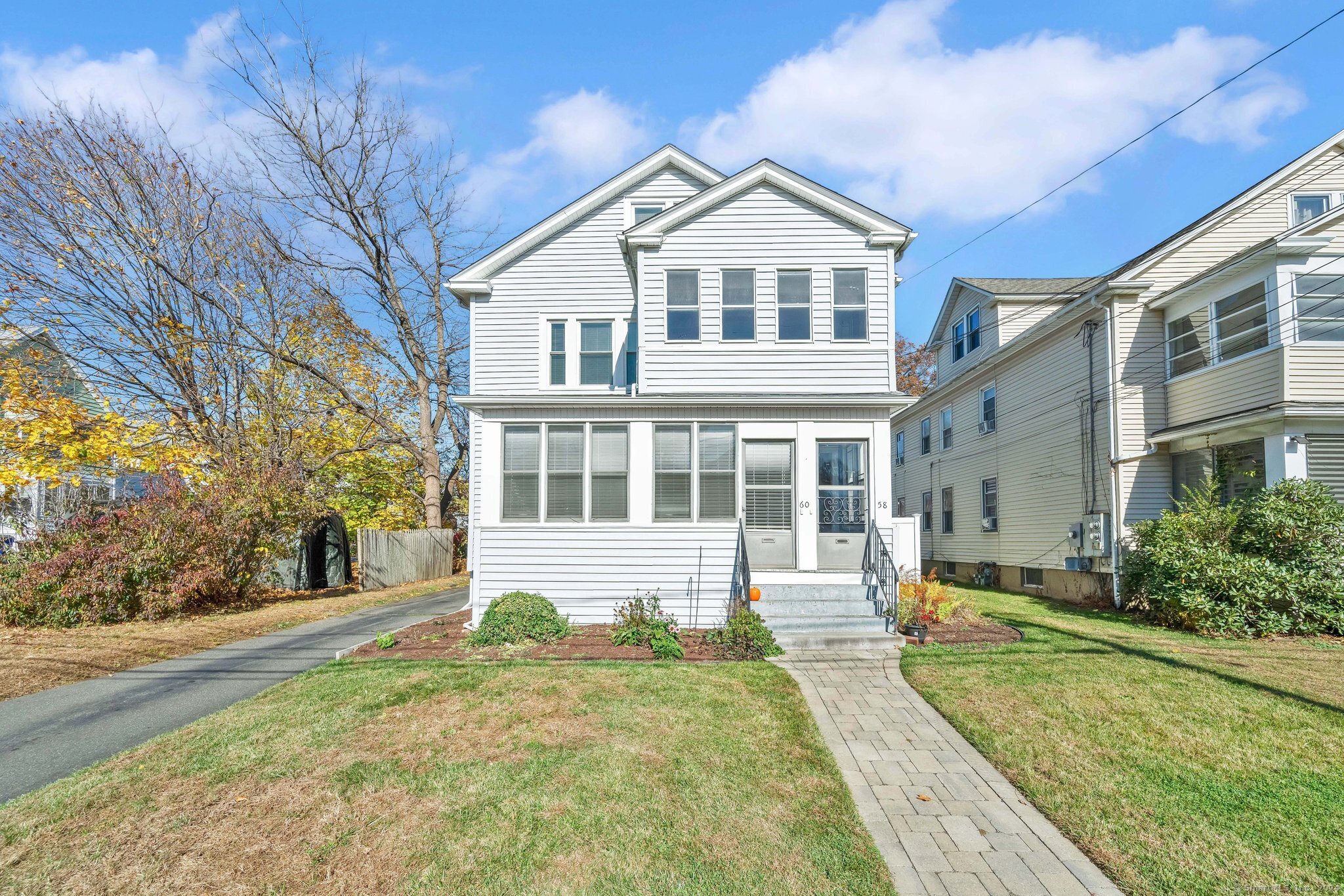 a front view of a house with a yard