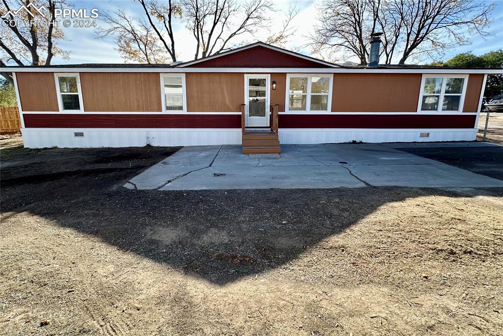 a front view of a house with yard