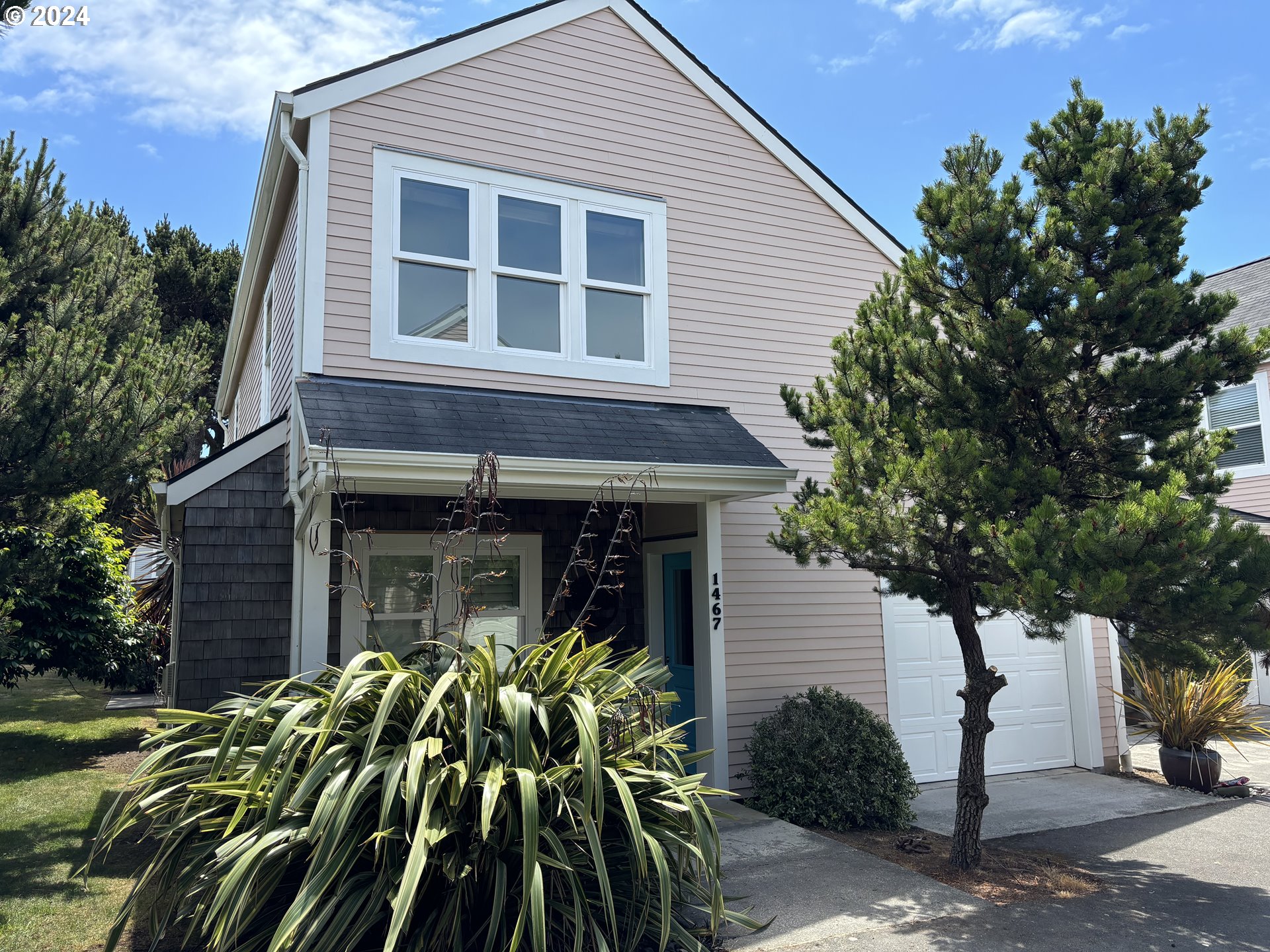 a view of a house with a tree