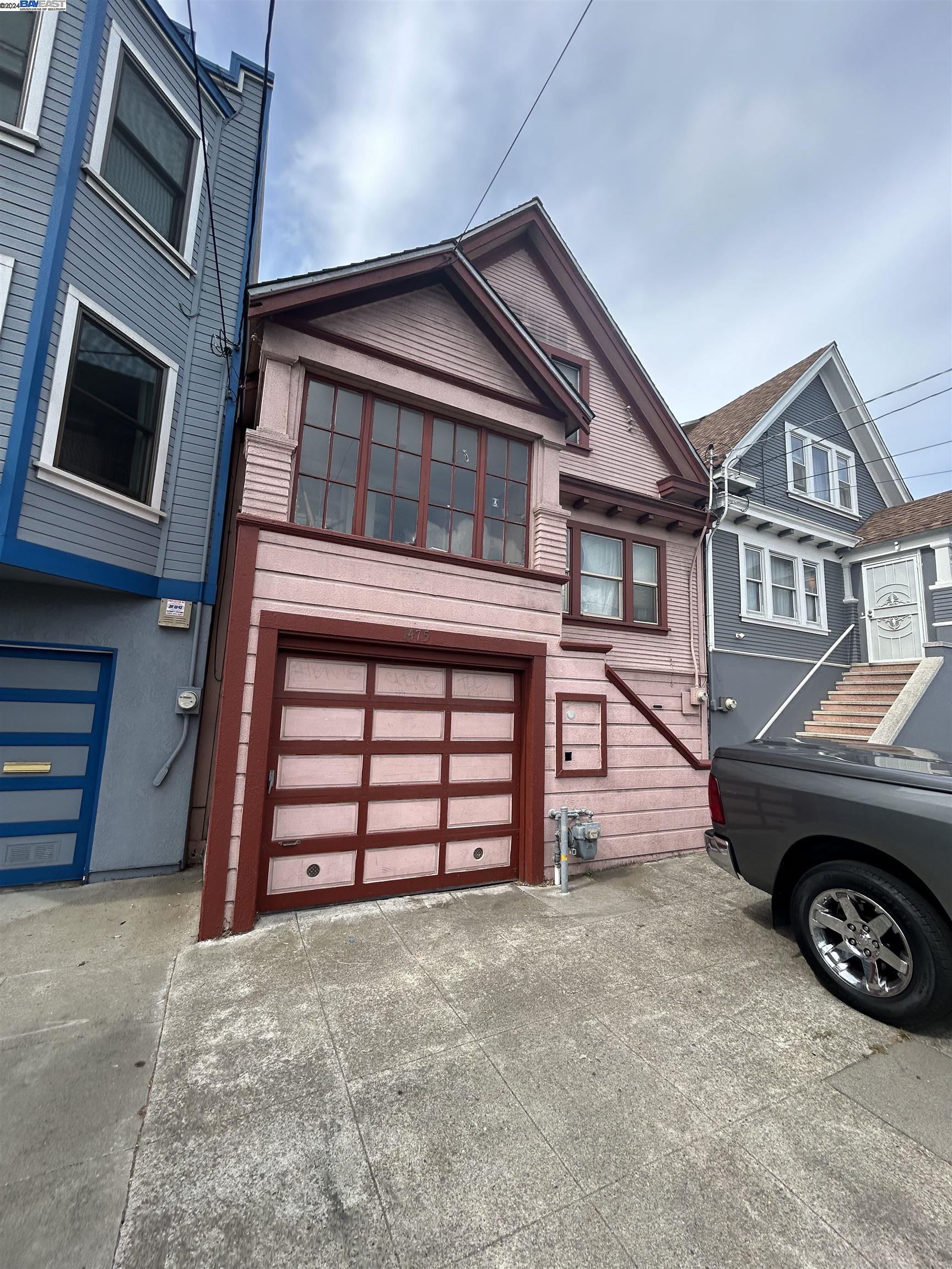 a view of a house with a parking space