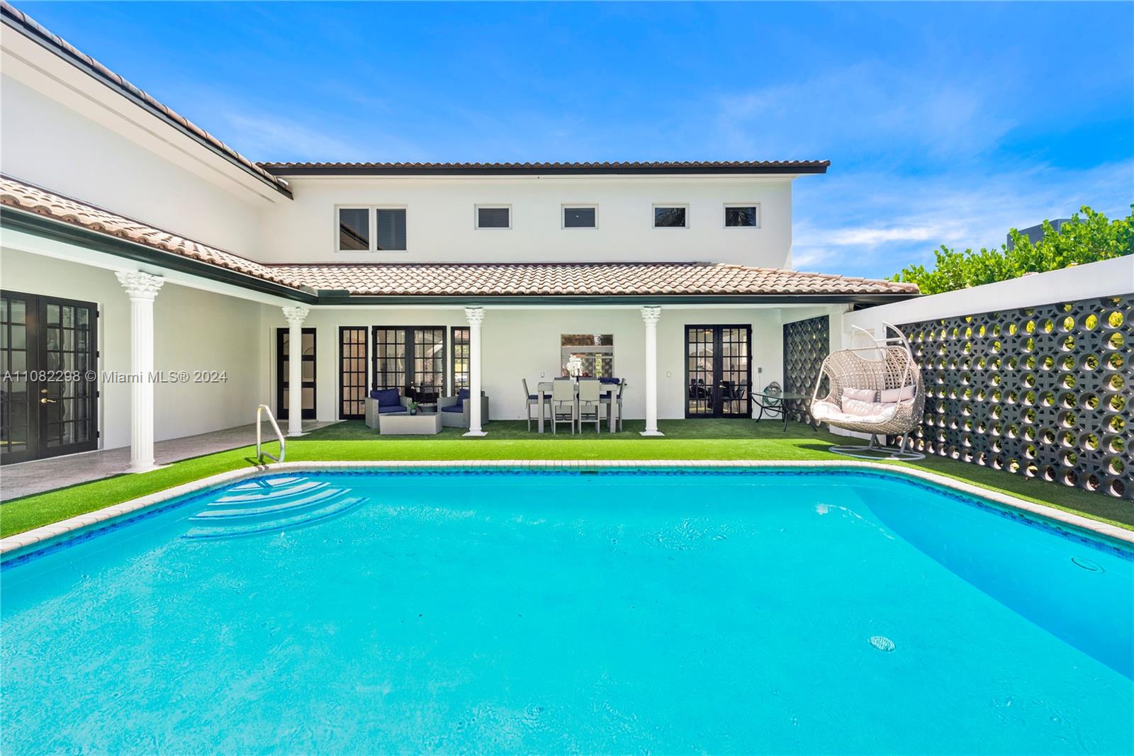 a view of swimming pool with outdoor seating