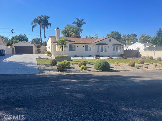 a front view of house with yard and seating space