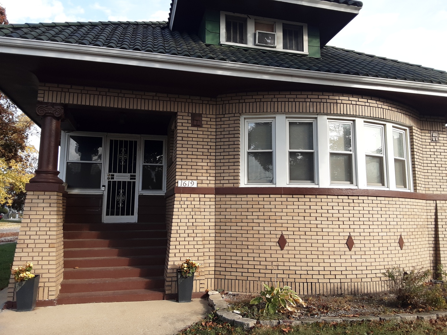 a view of brick building with large windows