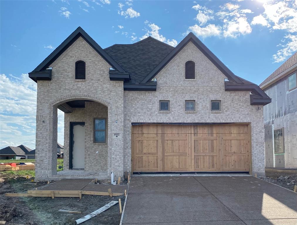 a front view of a house with a garage