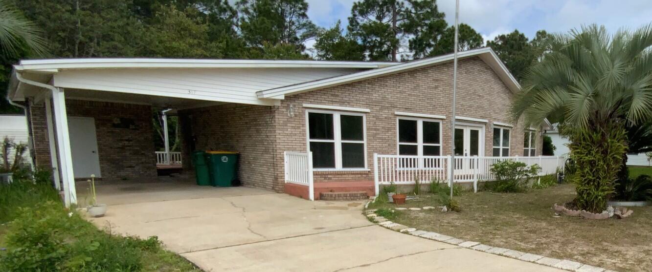 a view of a house with a yard