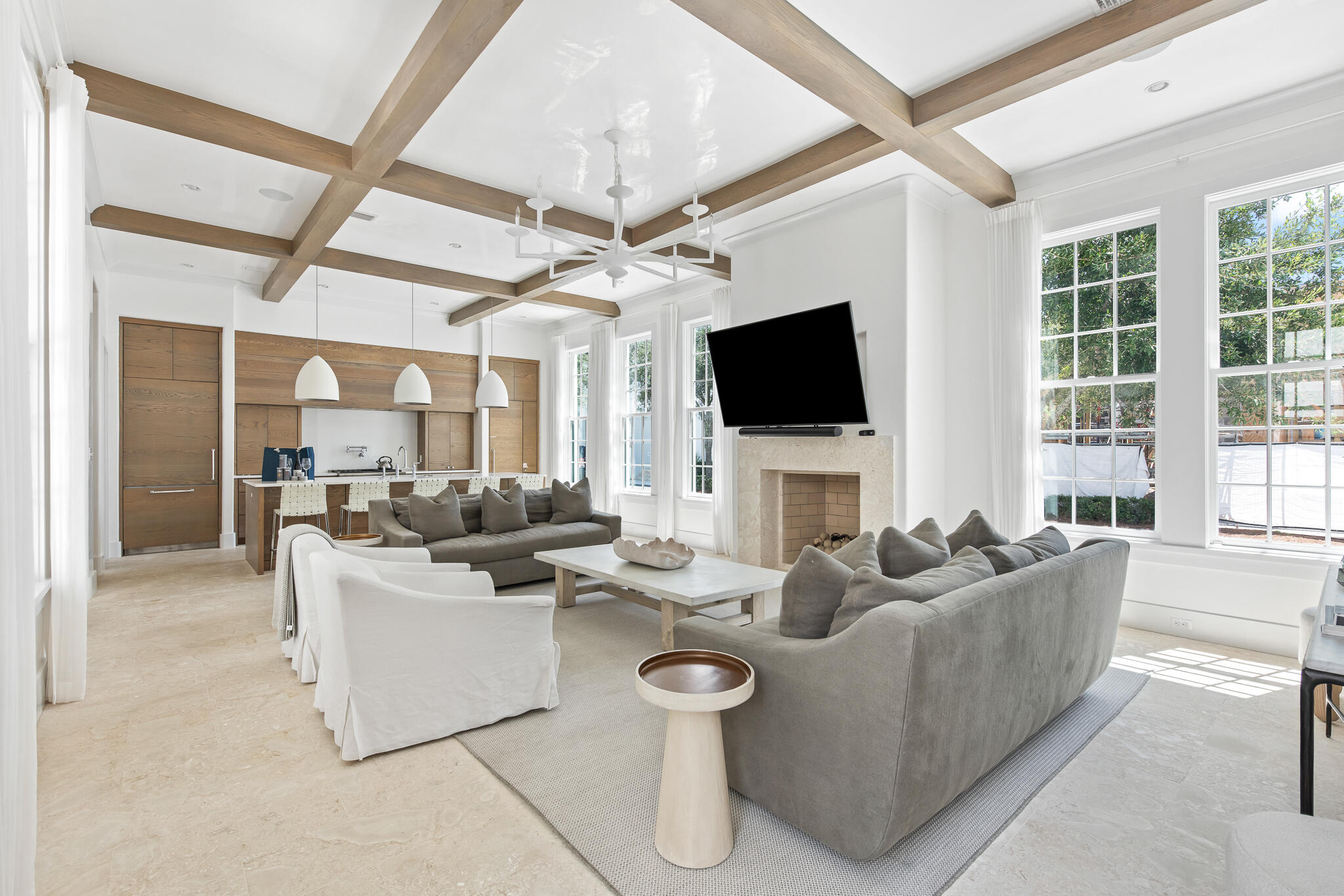 a living room with fireplace furniture and a flat screen tv