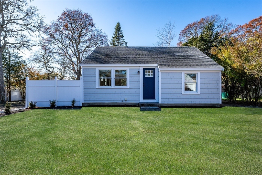 a brick house with a yard