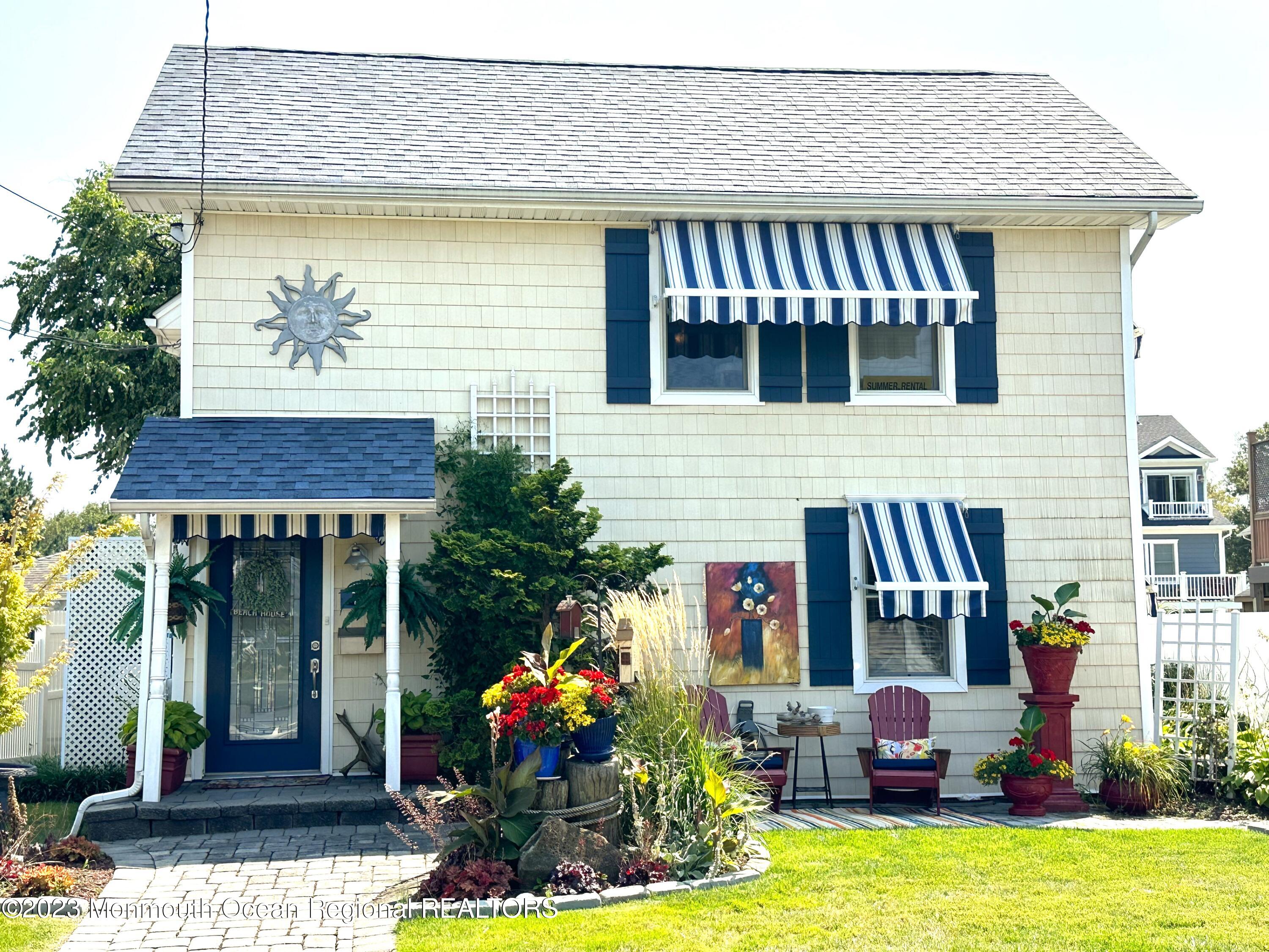 a front view of house with an outdoor seating