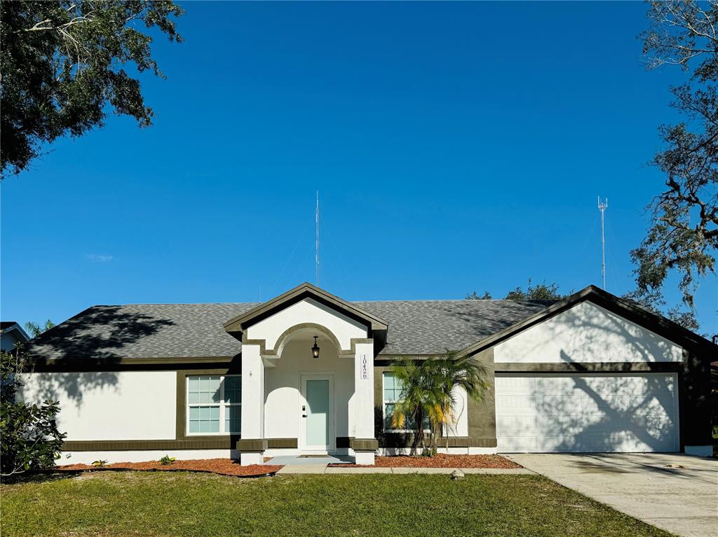 a front view of a house with a yard