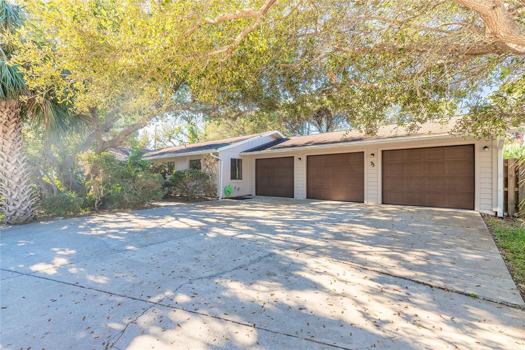 a view of a house with a yard and garage