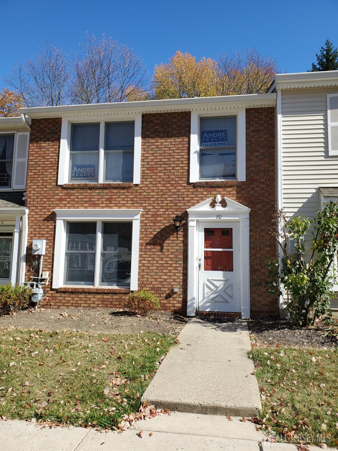 a front view of a house with yard