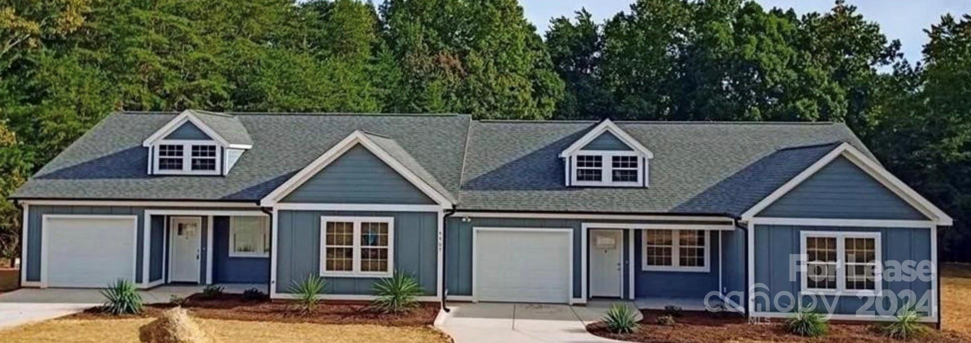 a house view with a garden space