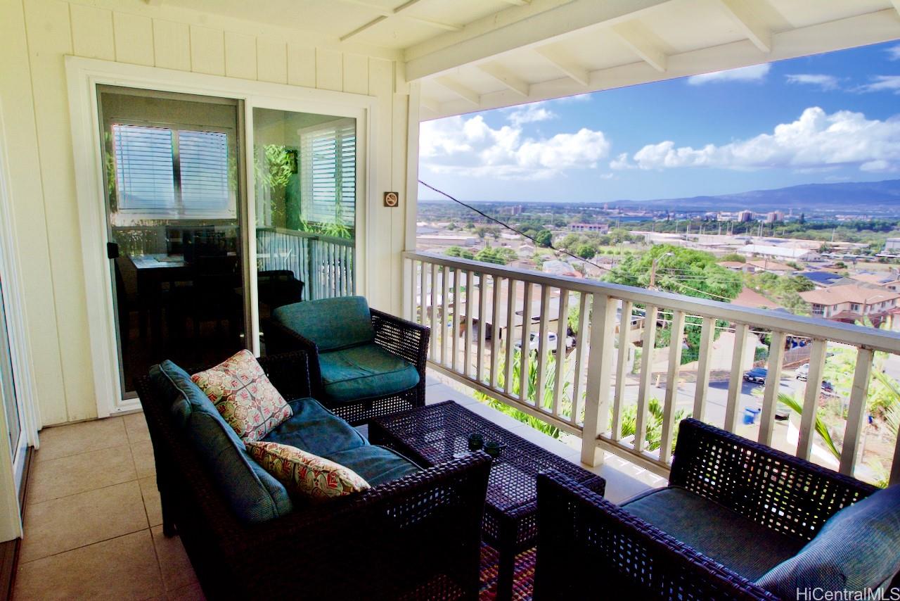 a view of a chairs in the balcony