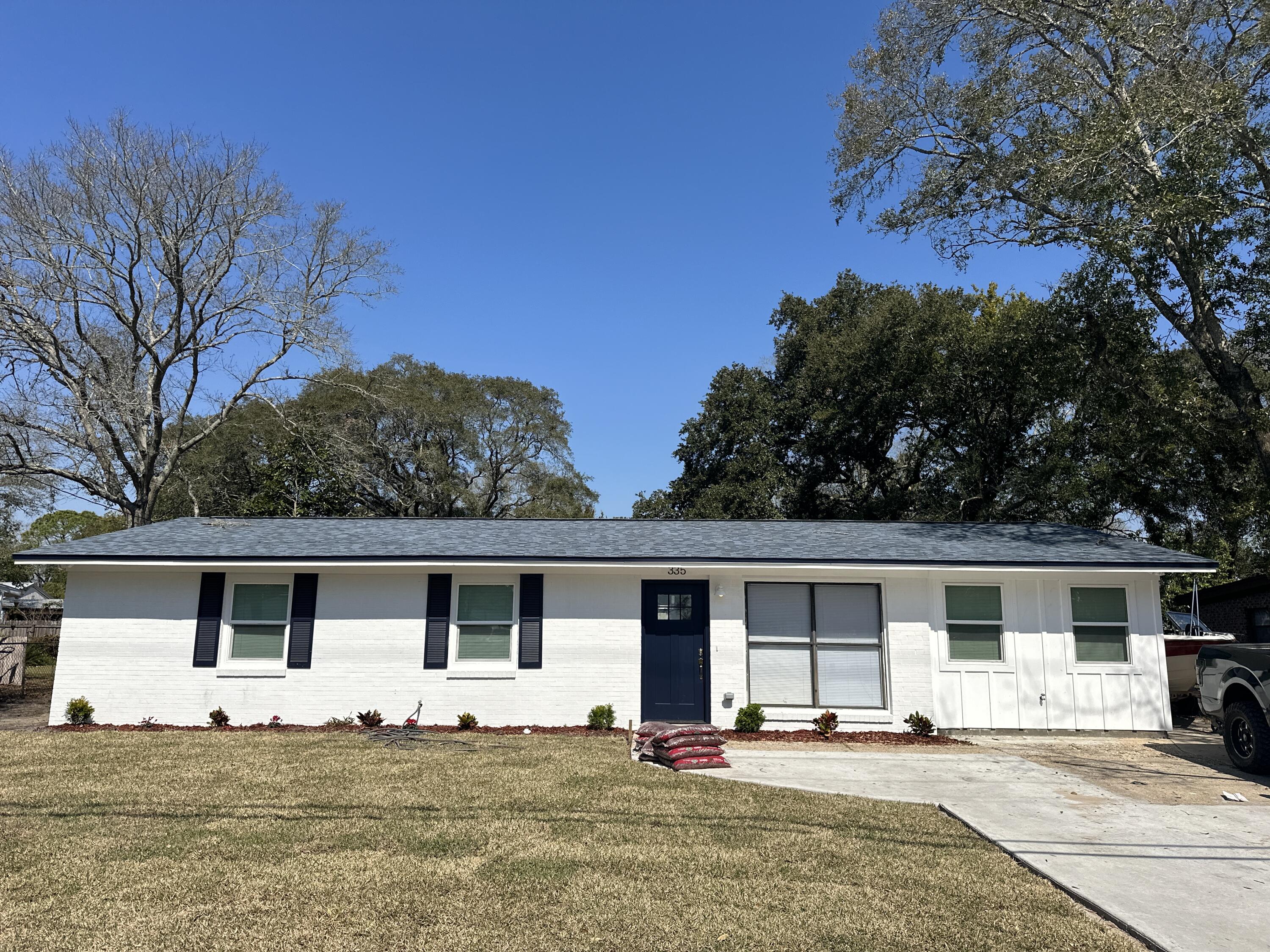 a house with trees in the background