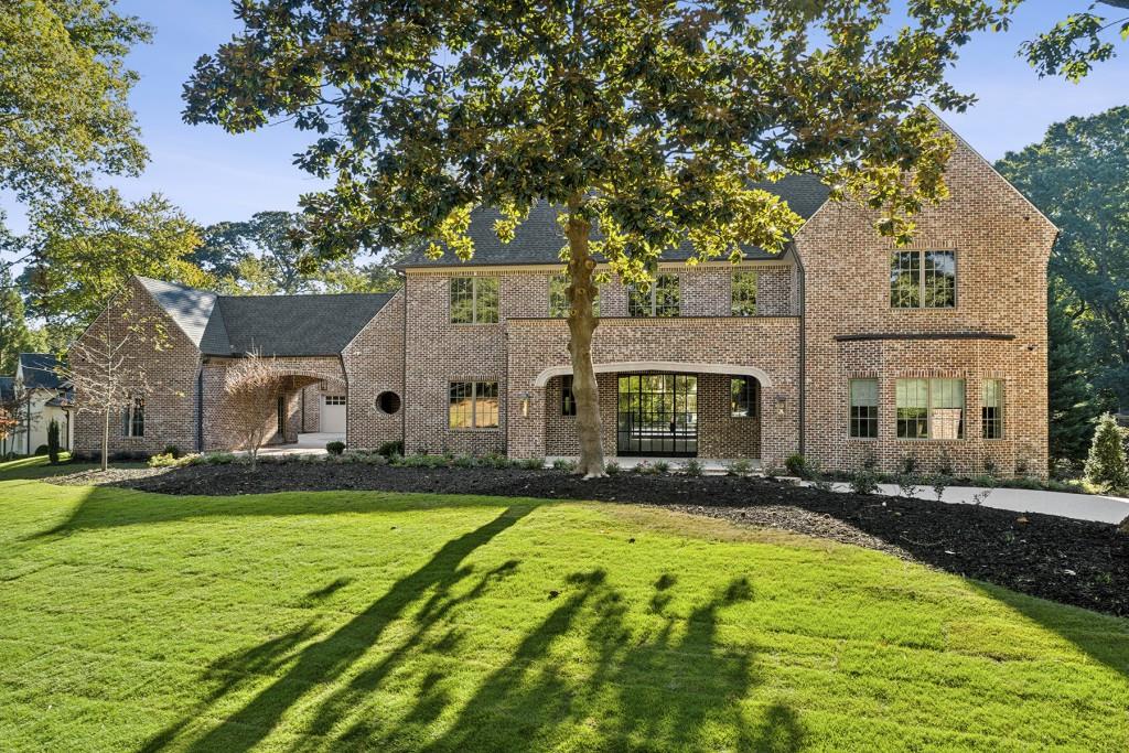 a view of a house with a yard