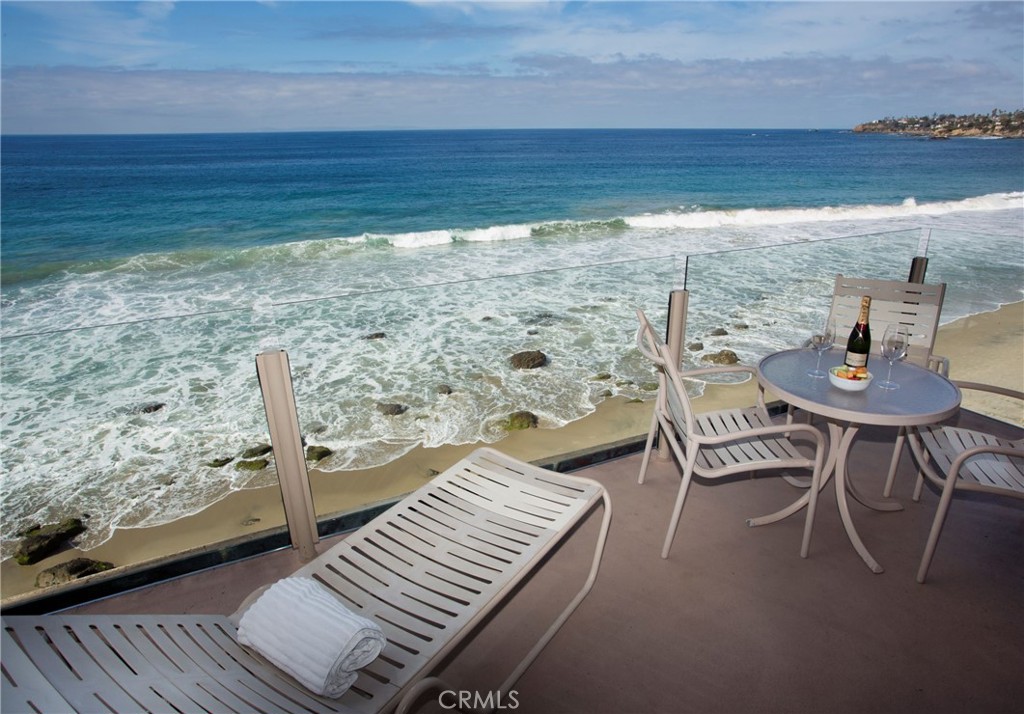 a view of a balcony with chair and table