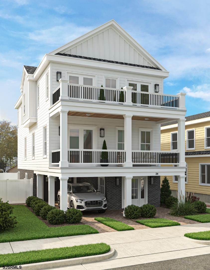 a front view of a residential apartment building with a yard