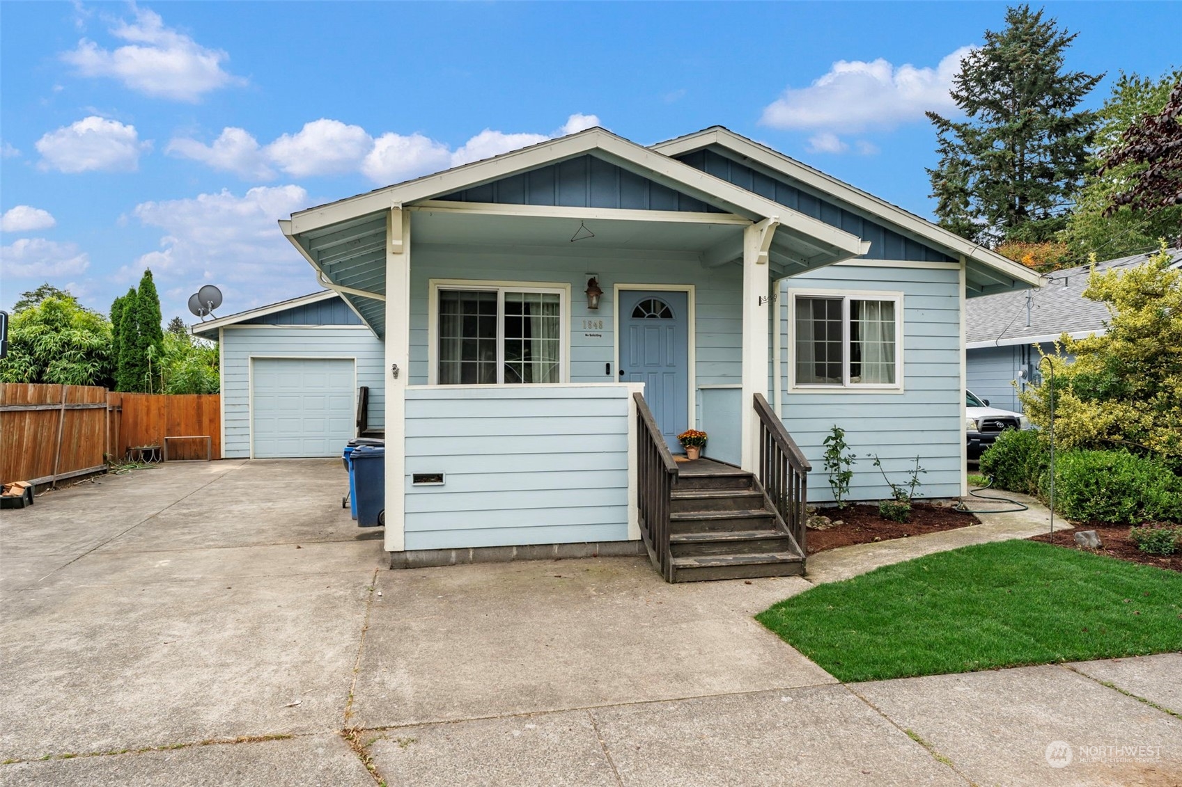 front view of a house with a yard