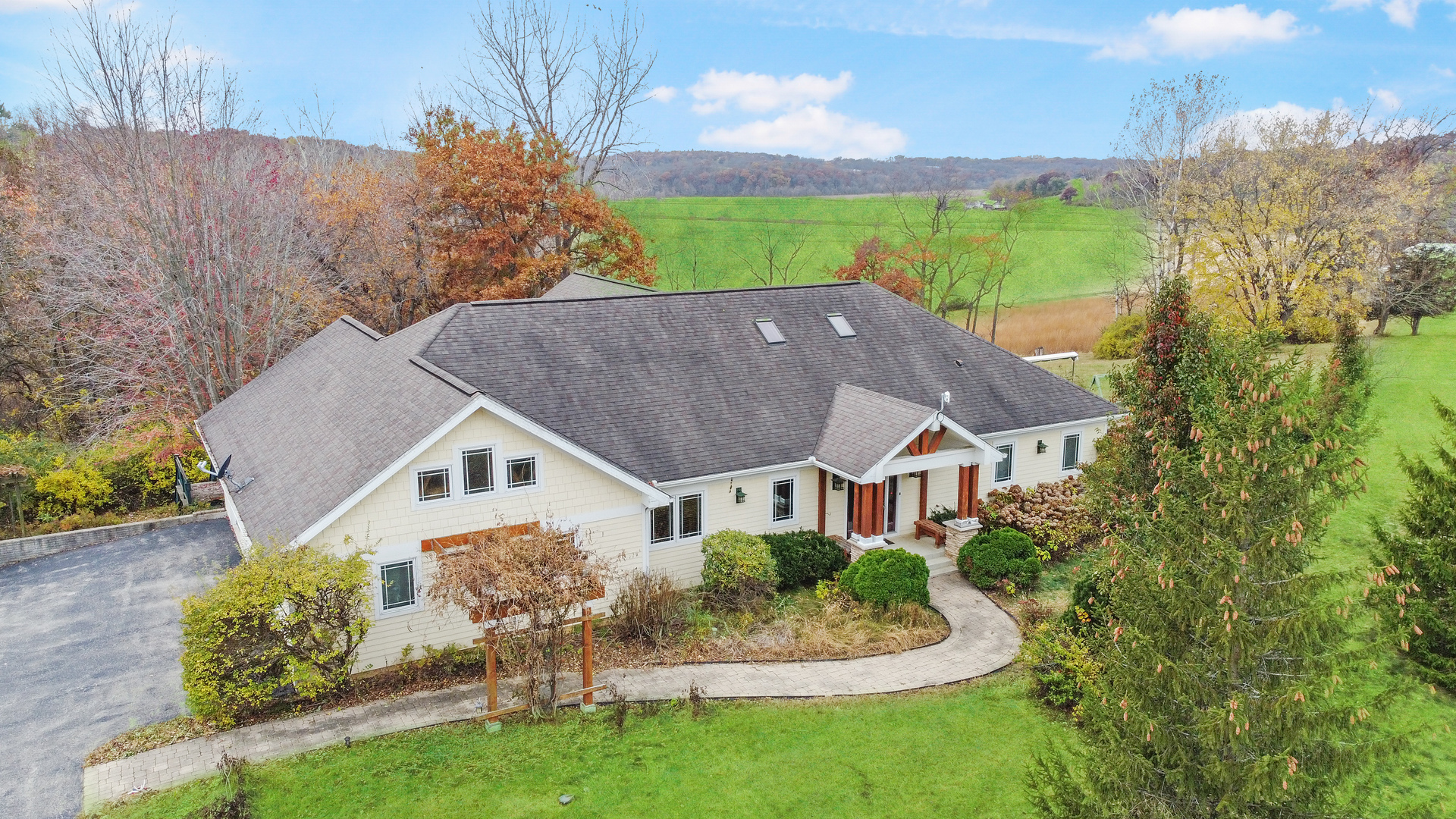 a aerial view of a house with a yard