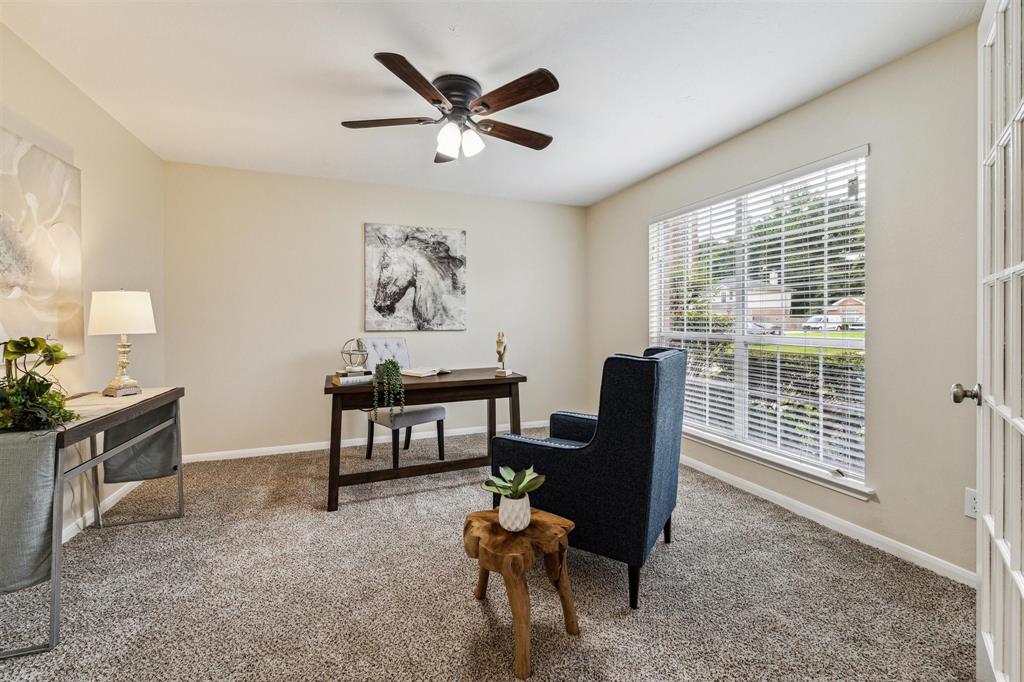 a view of a livingroom with furniture and a window