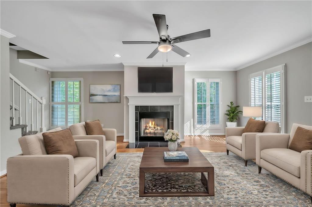 a living room with furniture and a fireplace