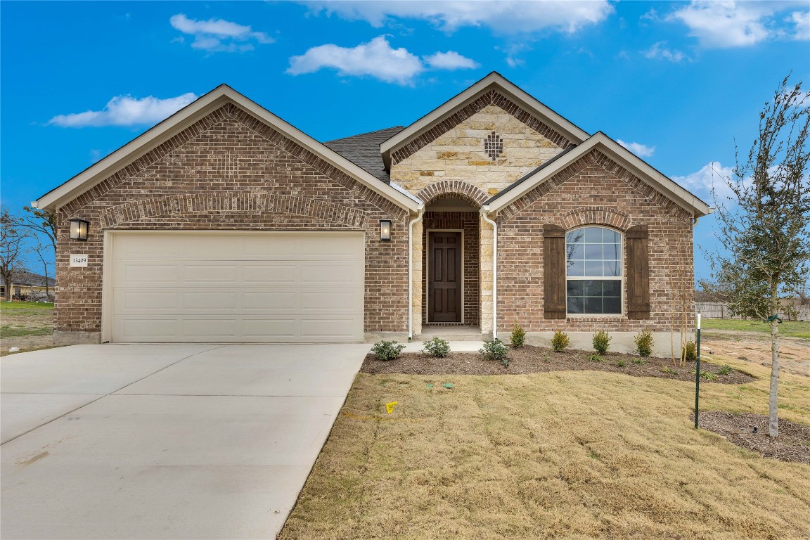 a front view of a house with yard