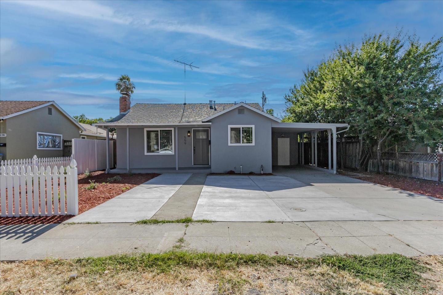 front view of a house with a bench