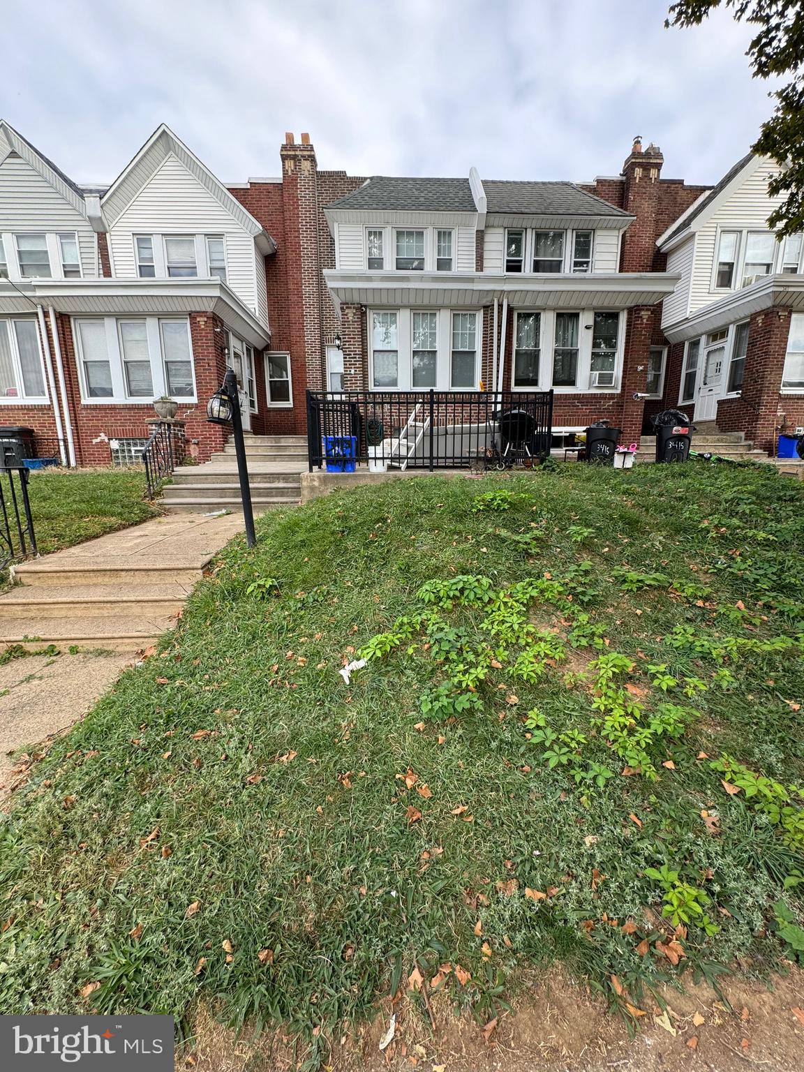 a front view of a house with a yard table and chairs