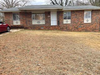 a front view of a house with yard