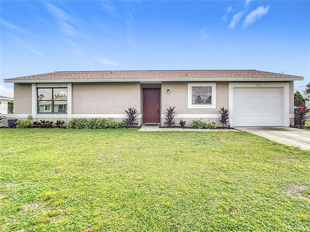 a house view with a garden space