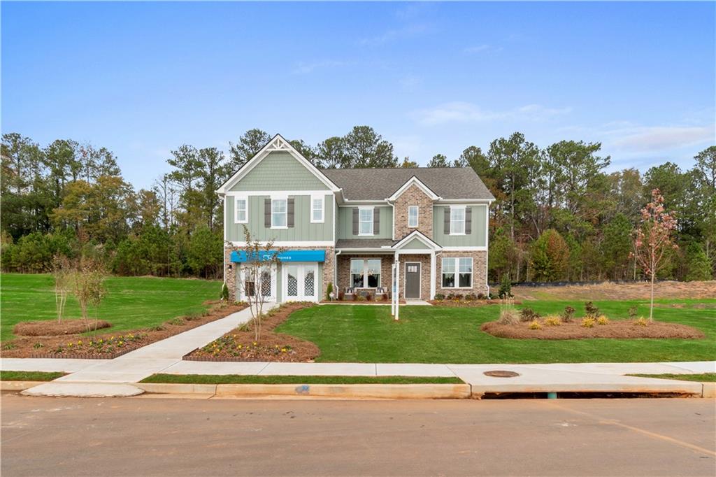 front view of a house next to a yard