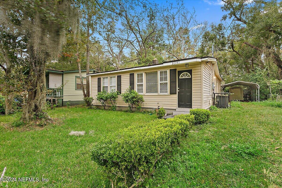 front view of a house with a yard