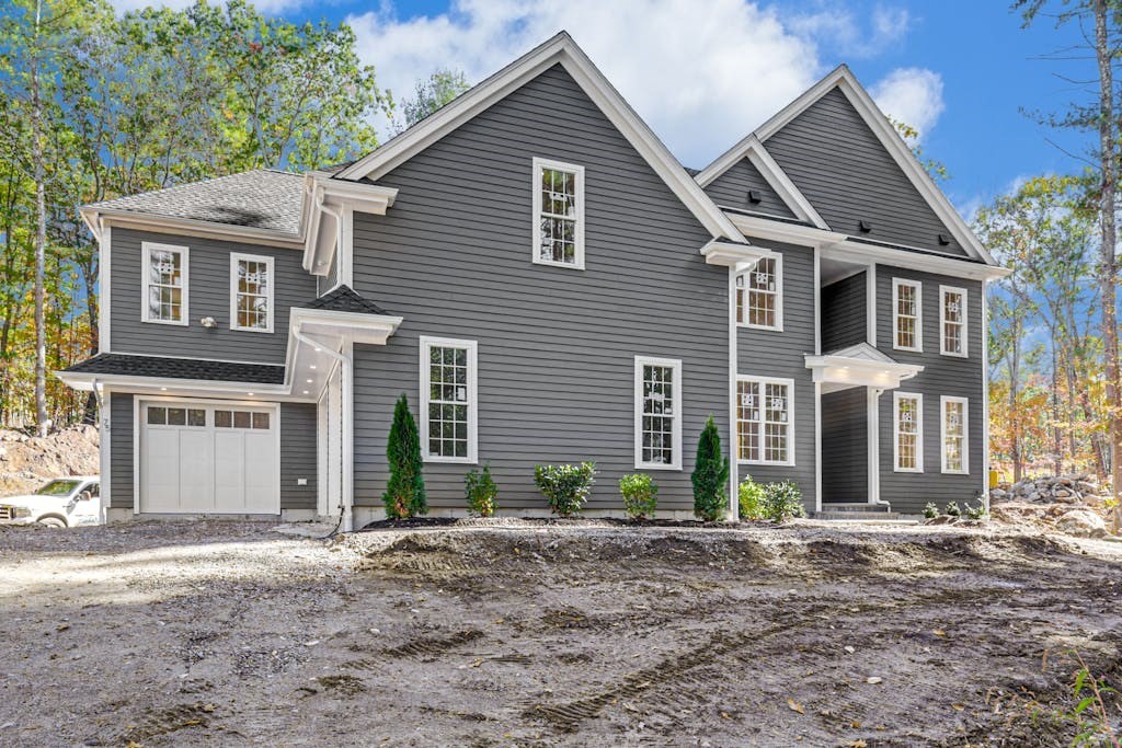 front view of a house with a yard