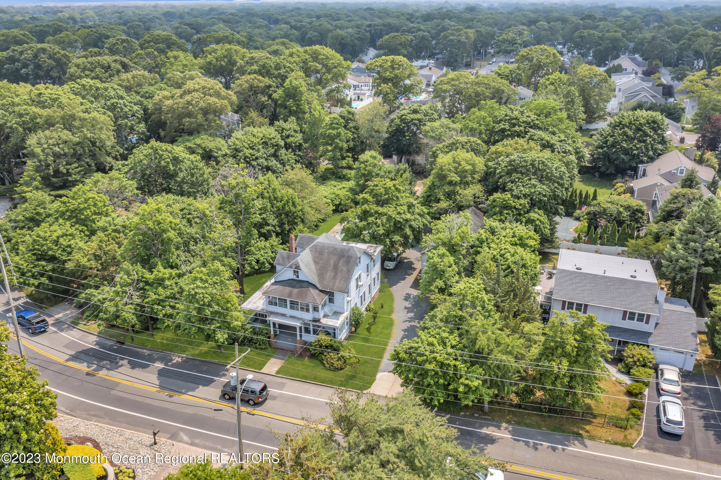 an aerial view of a house with a yard